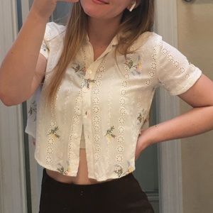 white, flower-embroidered top